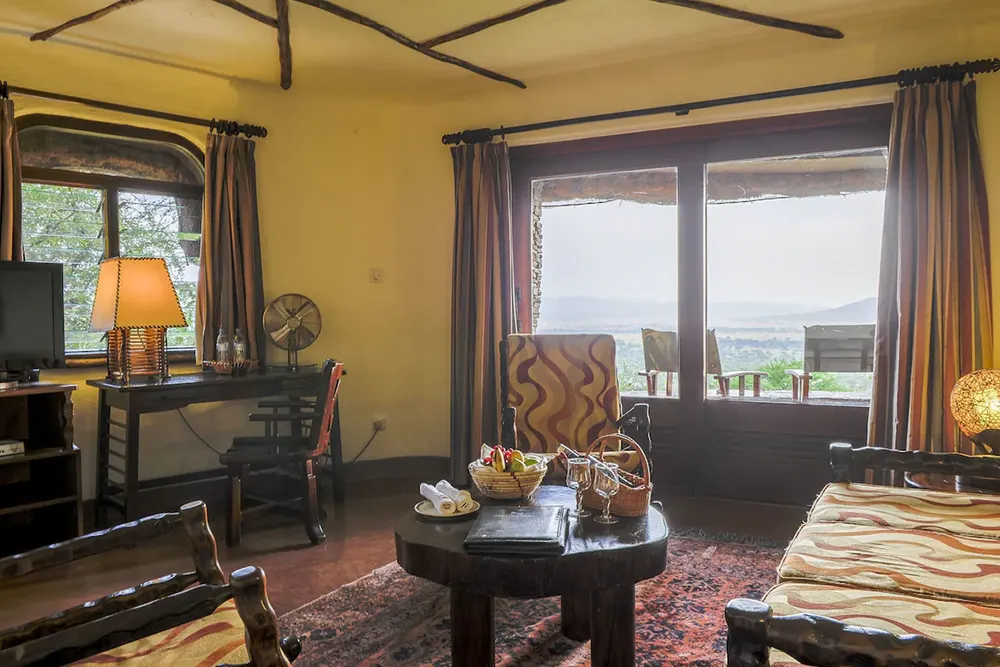 Standard Room - Living room - Flat-screen TV- Serengeti Serena Safari Lodge